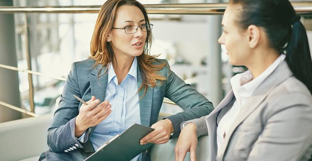 Two Businesswomen Talking to Each Other 